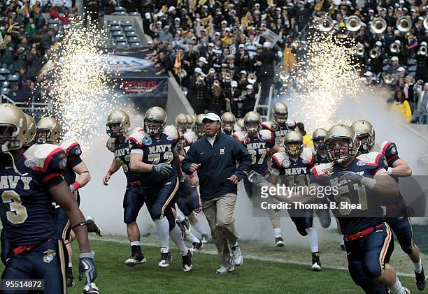 Head coach Ken Niumatalolo of the Navy Shipmen runs onto the field before the Texas Bowl at Reliant Stadium on December 31, 2009 in Houston, Texas....
