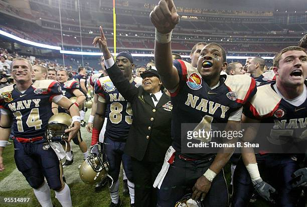 Quarterback Ricky Dobbs of the Navy Shipmen celebrates after the Texas Bowl at Reliant Stadium on December 31, 2009 in Houston, Texas. The Navy...