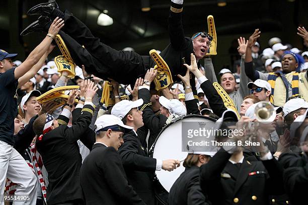 Navy Shipmen celebrate after the Texas Bowl at Reliant Stadium on December 31, 2009 in Houston, Texas. The Navy Shipmen beat the Missouri Tigers 35...