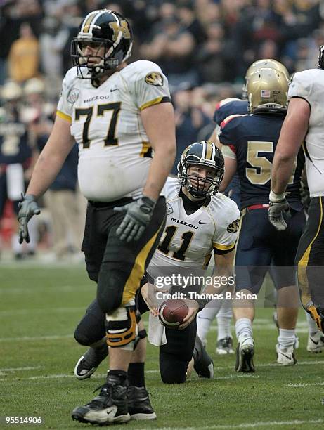 Quarterback Blaine Gabbert of the Missouri Tigers gets up after being sacked by the Navy Shipmen after the Texas Bowl at Reliant Stadium on December...