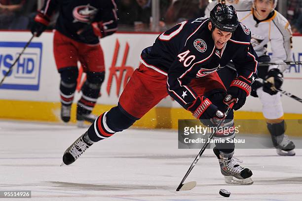 Jared Boll of the Columbus Blue Jackets skates the puck up ice against the Nashville Predators during the first period on December 31, 2009 at...