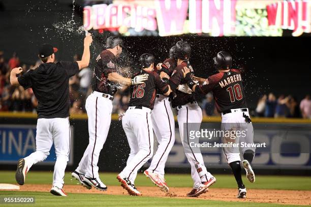 Pollock of the Arizona Diamondbacks celebrates a walk off single with teammates during the MLB game against the Houston Astros at Chase Field on May...