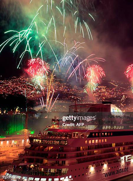 Fireworks light up the sky over Funchal Bay on Madeira Island early on Januray 1, 2010 in celebration of New Year's Day. Revellers rang in the New...