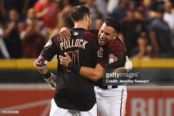 Pollock of the Arizona Diamondbacks celebrates a walk off single with David Peralta during the MLB game against the Houston Astros at Chase Field on...