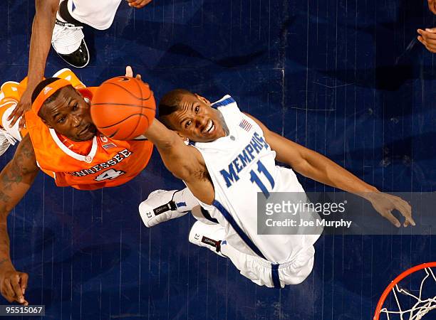 Wesley Witherspoon of the Memphis Tigers fights for a rebound against Wayne Chism of the Tennessee Volunteers on December 31, 2009 at FedExForum in...