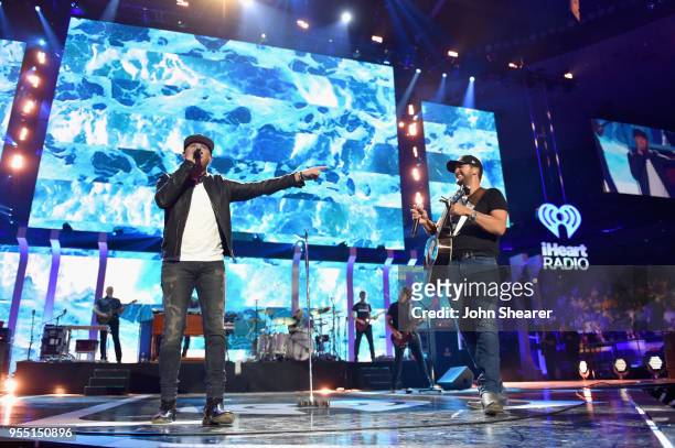 Cole Swindell and Luke Bryan perform onstage during the 2018 iHeartCountry Festival By AT&T at The Frank Erwin Center on May 5, 2018 in Austin, Texas.
