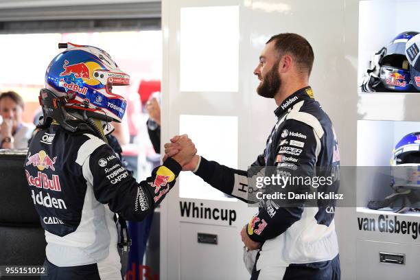 Jamie Whincup driver of the Red Bull Holden Racing Team Holden Commodore ZB congratulates Shane Van Gisbergen driver of the Red Bull Holden Racing...