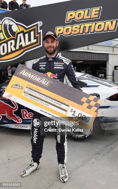 Shane Van Gisbergen driver of the Red Bull Holden Racing Team Holden Commodore ZB celebrates after taking pole position for race 12 for the Supercars...