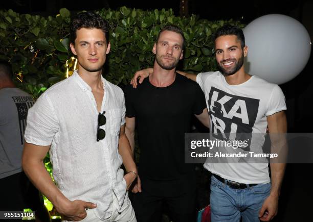 Garrett Neff, Jeffim K and Shlomi Gilady are seen at the PARAISO Fashion Fair launch party at W South Beach on May 6, 2018 in Miami, Florida.