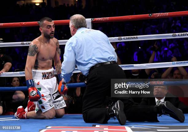 Vanes Martirosyan is counted out by referee Jack Reiss giving Gennady Golovkin a second round knockout win during the WBC-WBA Middleweight...