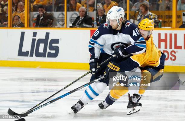 Joel Armia of the Winnipeg Jets skates against Ryan Ellis of the Nashville Predators in Game Five of the Western Conference Second Round during the...