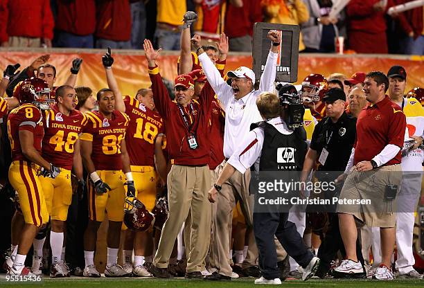 Head coach Paul Rhoads of the Iowa State Cyclones celebrates with teammates after defeating the Minnesota Golden Gophers in the Insight Bowl at...