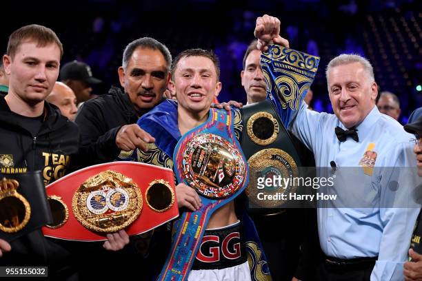 Gennady Golovkin poses with his belts with referee Jack Reiss after a second round knockout win over Vanes Martirosyan during the WBC-WBA...