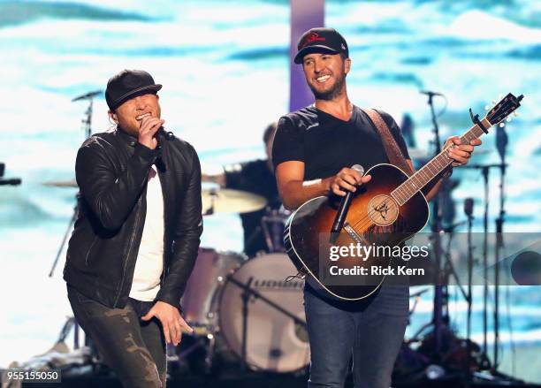 Cole Swindell and Luke Bryan perform onstage during the 2018 iHeartCountry Festival By AT&T at The Frank Erwin Center on May 5, 2018 in Austin, Texas.