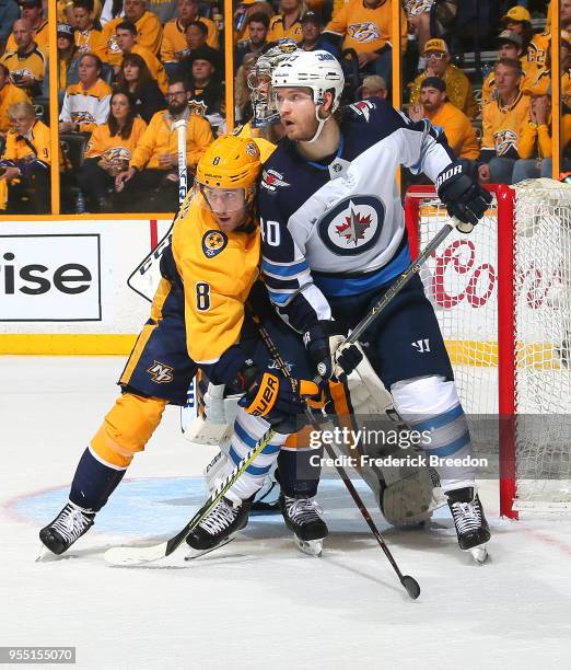 Kyle Turris of the Nashville Predators ties up Joel Armia of the Winnipeg Jets during the second period of Game Five of the Western Conference Second...