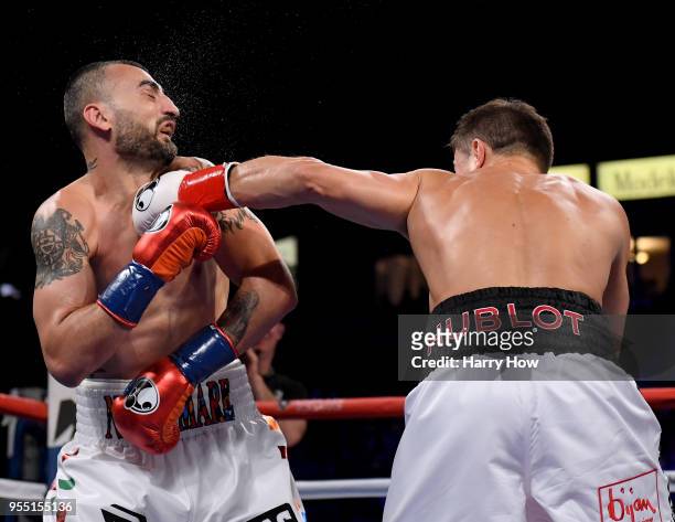 Vanes Martirosyan takes a punch from Gennady Golovkin losing in a second round knockout during the WBC-WBA Middleweight Championship at StubHub...