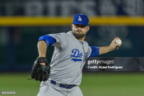 Relief pitcher Adam Liberatore of Los Angeles Dodgers pitches on the seventh inning during the MLB game against the San Diego Padres at Estadio de...