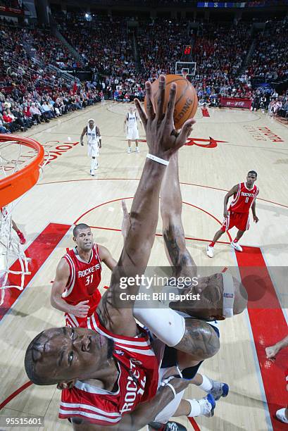 Carl Landry of the Houston Rockets blocks Erick Dampier of the Dallas Mavericks on December 31, 2009 at the Toyota Center in Houston, Texas. NOTE TO...