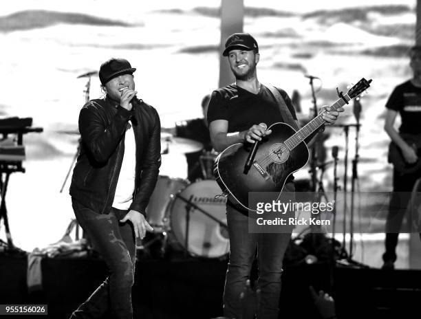 Cole Swindell and Luke Bryan perform onstage during the 2018 iHeartCountry Festival By AT&T at The Frank Erwin Center on May 5, 2018 in Austin, Texas.