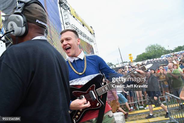 Guitarist Brad Shultz of the band Cage the Elephant performs during Day 6 of the 2018 New Orleans Jazz & Heritage Festival at Fair Grounds Race...