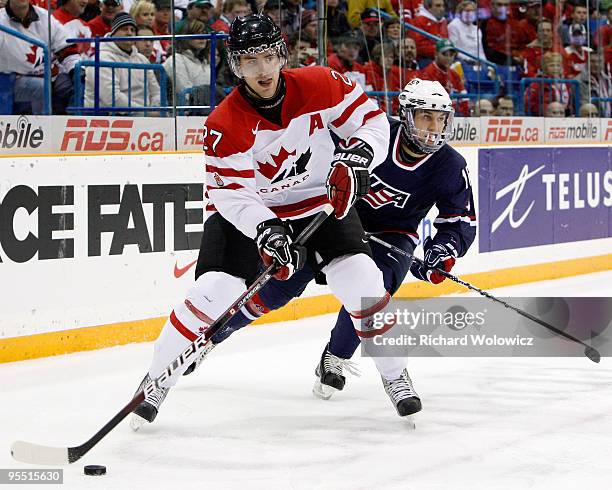 Alex Pietrangelo of Team Canada skates with the puck while being chased by Jason Zucker of Team USA during the 2010 IIHF World Junior Championship...