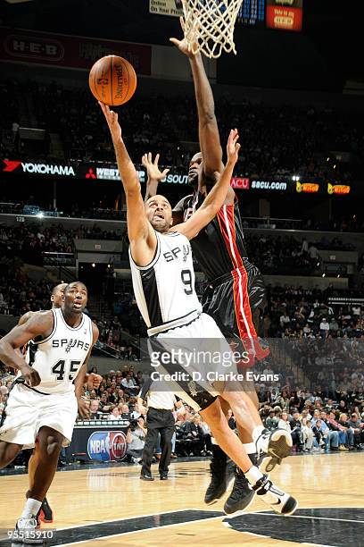 Tony Parker of the San Antonio Spurs shoots a layup against Joel Anthony of the Miami Heat on December 31, 2009 at the AT&T Center in San Antonio,...