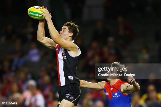 Nick Coffield of the Saints marks the ball against Mitch Hannan of the Demons during the round seven AFL match between St Kilda Saints and the...