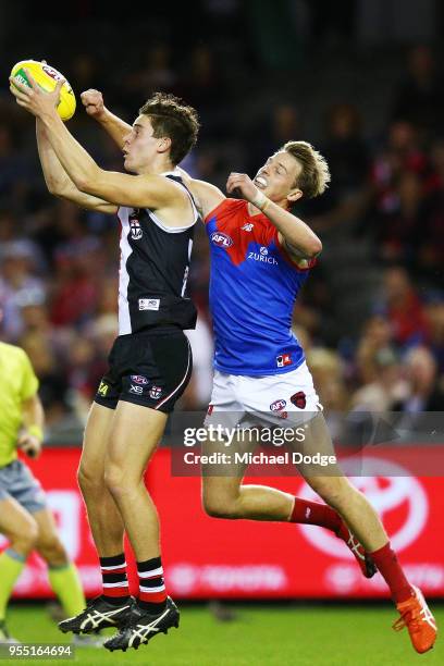 Nick Coffield of the Saints marks the ball against Mitch Hannan of the Demons during the round seven AFL match between St Kilda Saints and the...