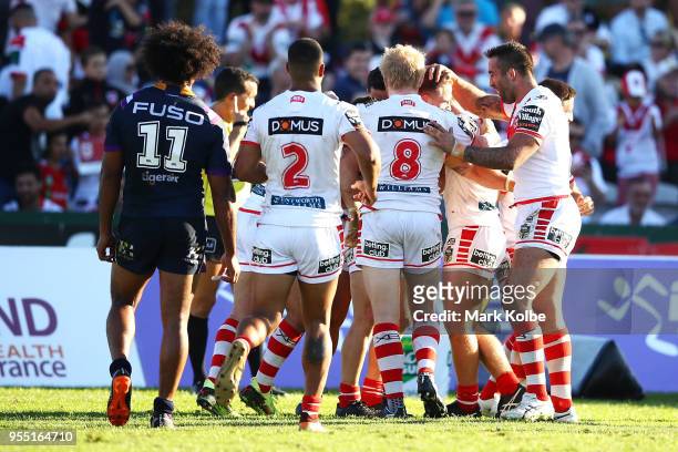 Euan Aitken of the Dragons celebrates with his team mates after scoring a try during the round nine NRL match between the St George Illawarra Dragons...