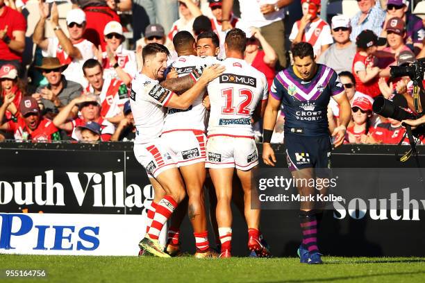 Tim Lafai of the Dragons celebrates with his team mates after scoring a try during the round nine NRL match between the St George Illawarra Dragons...