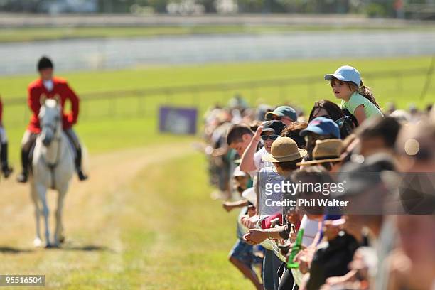 Public watch the racing action on New Years Day during the New Zealand Christmas Carnival meeting at the Ellerslie Racecourse on January 1, 2010 in...