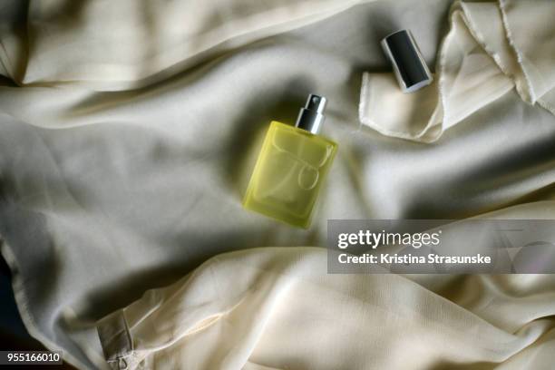 perfume bottle and white blouse - perfume sprayer ストックフォトと画像