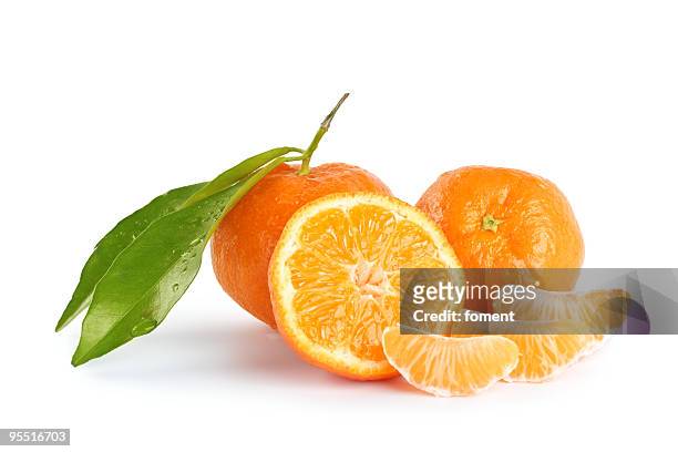 whole and sliced mandarins on a white background - tangerine stock pictures, royalty-free photos & images
