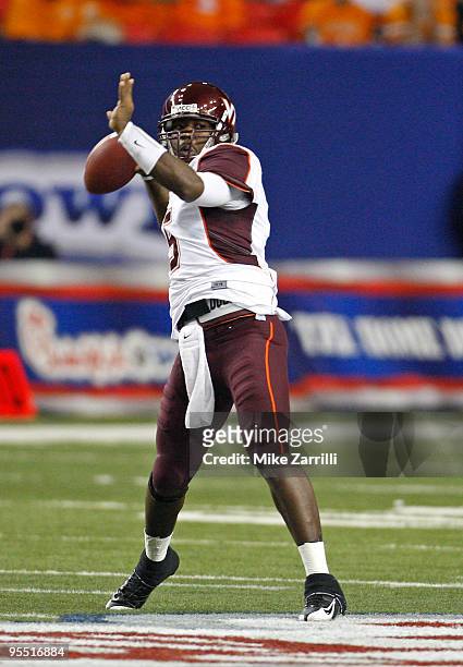 Quarterback Tyrod Taylor of the Virginia Tech Hokies throws a pass during the Chick-Fil-A Bowl against the Tennessee Volunteers at the Georgia Dome...