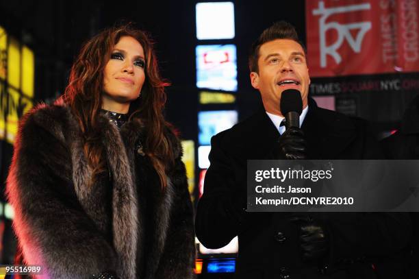Singer Jennifer Lopez and host Ryan Seacrest celebrate onstage during Dick Clark's New Year's Rockin' Eve With Ryan Seacrest 2010 in Times Square on...
