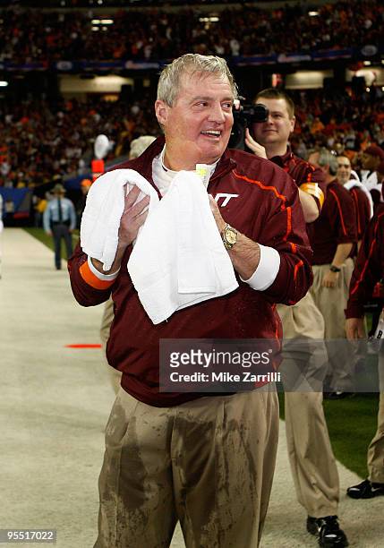 Head coach Frank Beamer of the Virginia Tech Hokies dries himself after being dunked with sports drink during the Chick-Fil-A Bowl against the...