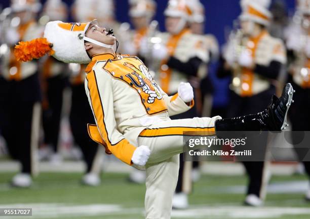 The Tennessee Volunteers drum major leads the band on the field before the Chick-Fil-A Bowl against the Virginia Tech Hokies at the Georgia Dome on...