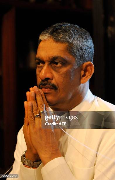 Sri Lanka's opposition presidential candidate General Sarath Fonseka offers prayers at a Buddhist temple in Kelaniya on January 1, 2010. Fonseka, the...