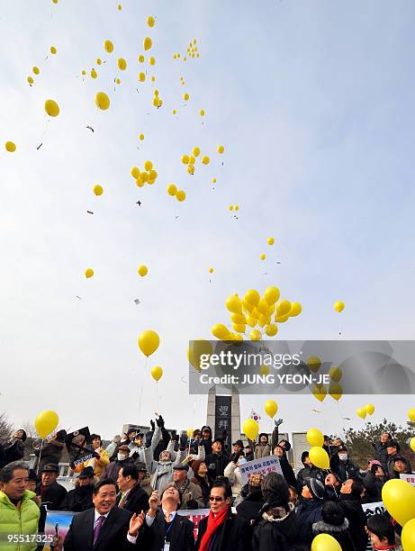 South Korean conservative activists release yellow balloons with anti-Pyongyang leaflets toward North Korea during an anti-North Korea rally at the...