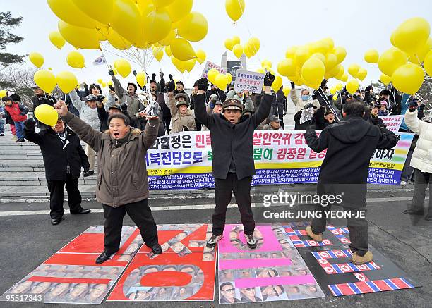 South Korean conservative activists shot slogans as they prepare to launch yellow balloons with anti-Pyongyang leaflets towards North Korea during an...