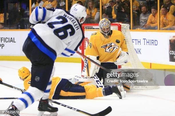 Nashville Predators goalie Juuse Saros makes a save on Winnipeg Jets right wing Blake Wheeler during Game Five of Round Two of the Stanley Cup...