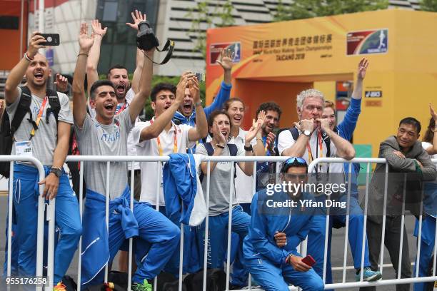 Members of team Italy cheer for third place Massimo Stano of Italy during medal ceremony of Men's 20 kilometres Race Walk of IAAF World Race Walking...