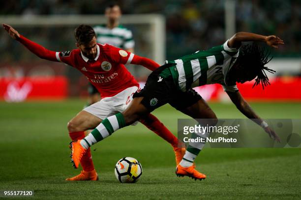 Benfica's midfielder Rafa Silva vies for the ball with Sporting's forward Gelson Martins during the Portuguese League football match between Sporting...