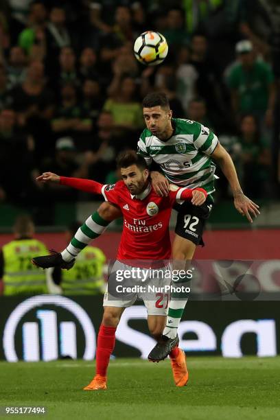 Sporting's defender Cristiano Piccini from Italy vies with Benfica's Portuguese midfielder Rafa Silva during the Primeira Liga football match...