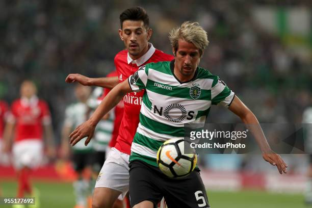 Sporting's defender Fabio Coentrao from Portugal vies with Benfica's Portuguese midfielder Pizzi during the Primeira Liga football match Sporting CP...