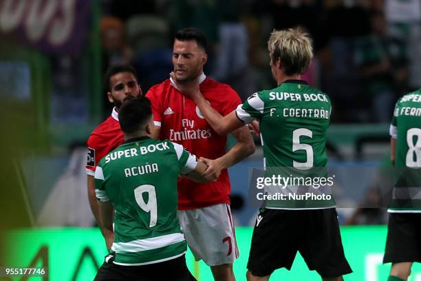 Sporting's midfielder Marcos Acuna from Argentina and Sporting's defender Fabio Coentrao from Portugal argue with Benfica's Brazilian defender...