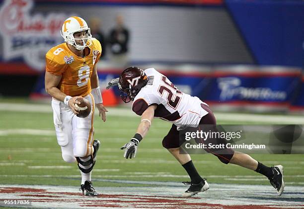 Cody Grimm of the Virginia Tech Hokies sacks Jonathan Crompton of the Tennessee Volunteers during the Chick-Fil-A Bowl game at the Georgia Dome on...