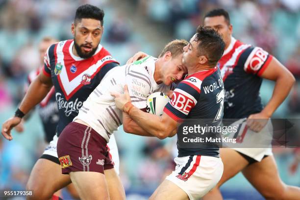 Daly Cherry-Evans of the Sea Eagles is tackled during the round nine NRL match between the Sydney Roosters and the Manly Warringah Sea Eagles at...