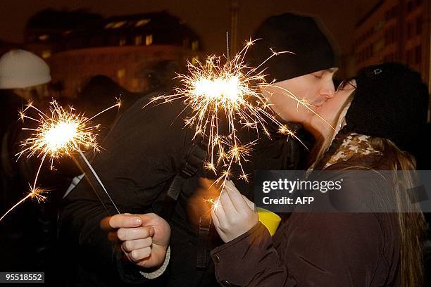 Couple kisses on New Year's eve in the center of Brussels on December 31, 2009. This year, the theme of the celebration was the 20th anniversary of...