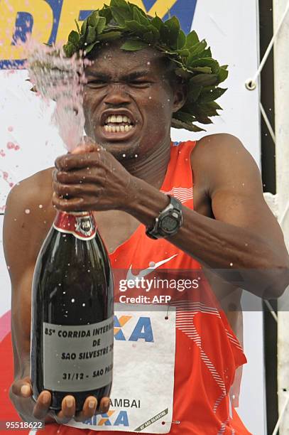 Kenyan runner James Kipsang celebrates on the podium after winning the 85rd Sao Silvestre New Year's Eve 15 km road race timing , on 31 December 2009...